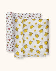 Little Miss Sunshine Swaddle Blanket set of two flat lay with rolled up fabric
