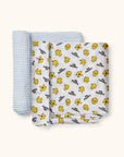 Mr. Happy Swaddle Blanket set of two with rolled up edges flat lay