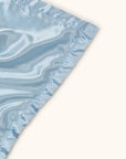 Mr. Happy security blanket showing reverse satin side
